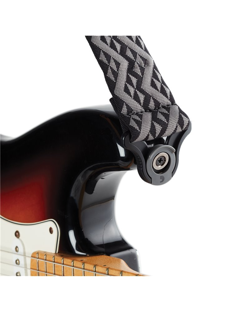 D’Addario. Correa para guitarra con autobloqueo, motivos geométricos negros acolchados
